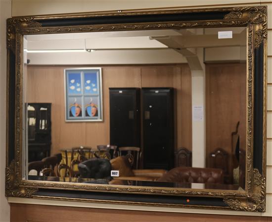 A modern gilt wall mirror, W.105cm